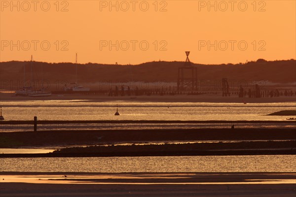 View from the island of Minsener Oog to Wangerooge at sunset