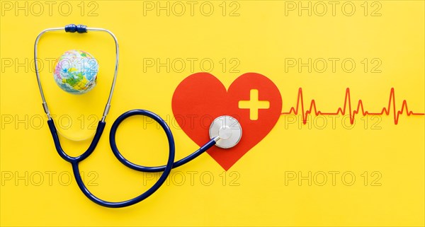 Top view paper heart with heartbeat stethoscope