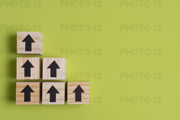 Arrows wooden cubes creating stairs