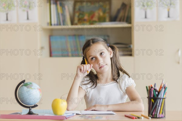 Girl thinking during lesson