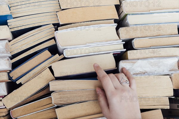 Person choosing books bookstore