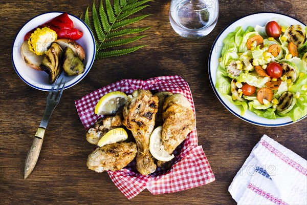 Grilled chicken legs with lemon salad