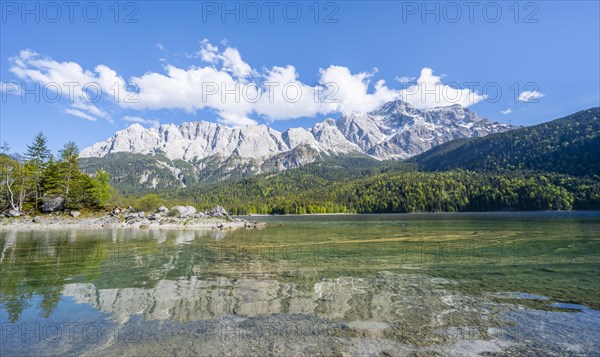 Zugspitze massif and Zugspitze reflected in Eibsee lake