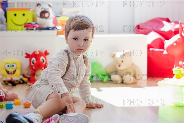 Boy sitting playroom