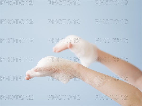 Close up hands with foam