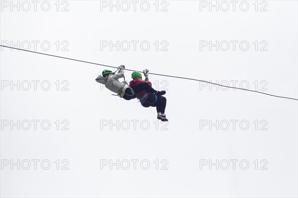 Two hiker zip line adventure against sky costa rica