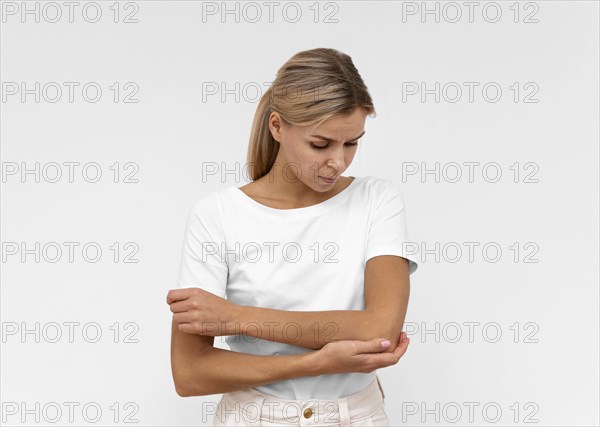 Front view woman with elbow pain