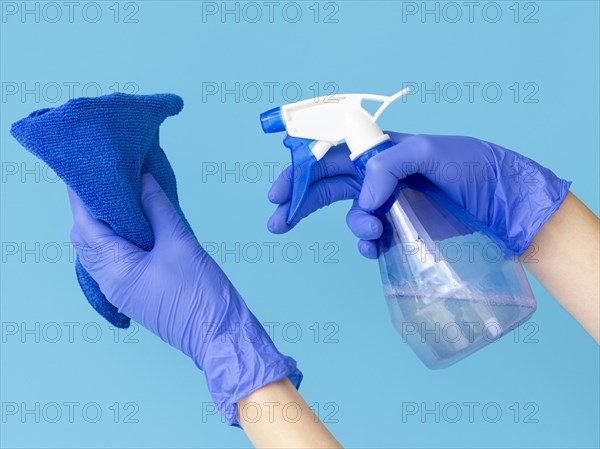 Hands with surgical gloves holding cloth ablution