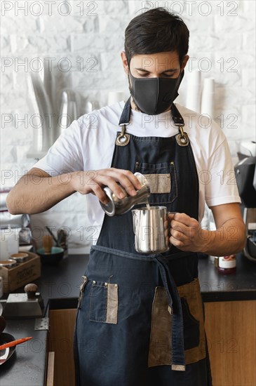 Man pouring milk