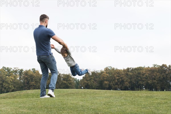 Father son playing grass