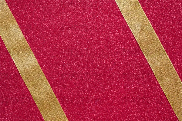 Two parallel ribbons red background