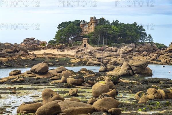 The rocks of the pink granite coast Cote de Granit Rose near Ploumanac'h and Costaeres Castle