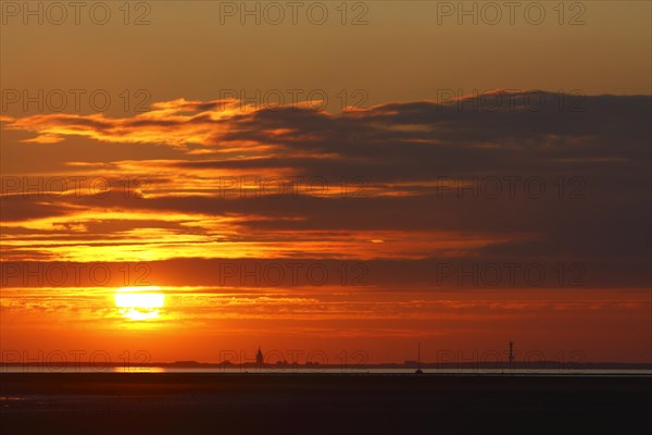 View from the island of Minsener Oog to Wangerooge at sunset