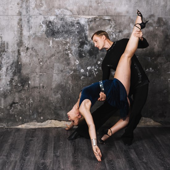 Couple performing stance during passionate dance