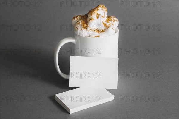 Stationery concept with business cards mug