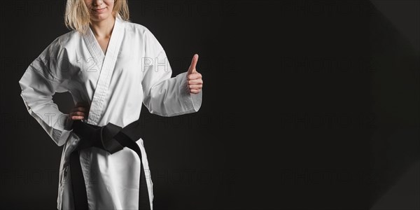 Unrecognizable fighter showing thumbs up