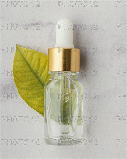 Top view serum bottle leaf