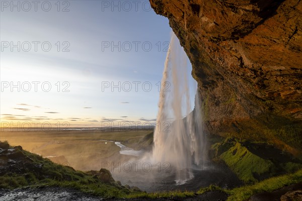 Seljalandsfoss waterfall at sunset