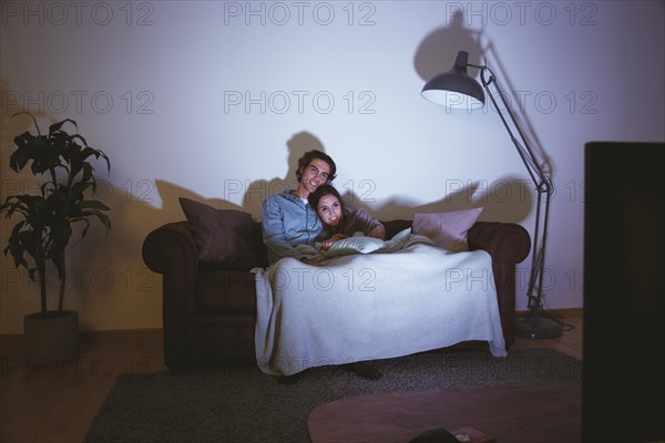 Couple watching movie together