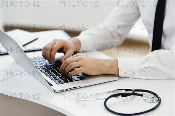 Close up hands typing keyboard