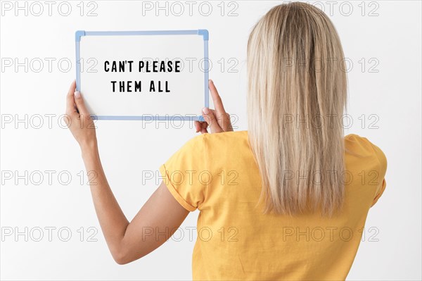 Medium shot woman holding board