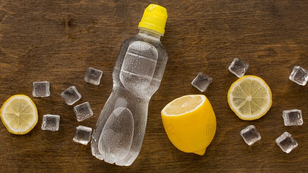 Plastic bottle water lemon top view