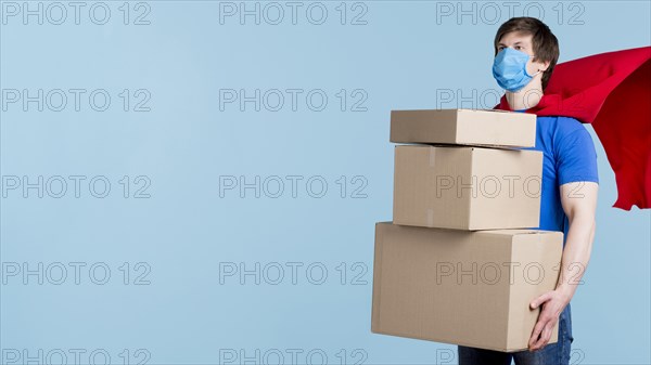 Delivery man carrying boxes