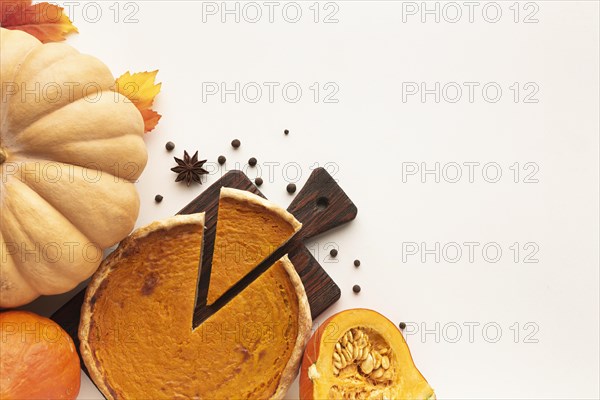 Flat lay assortment with sliced pie pumpkin