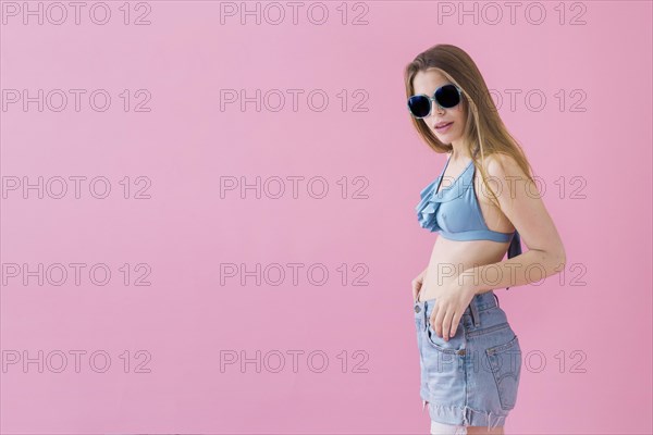 Woman bikini wearing sunglasses with copyspace