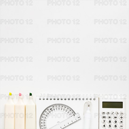 Top view back school essentials with calculator notebook