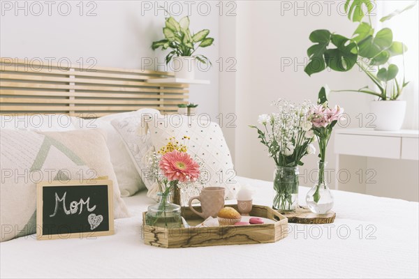 Mom inscription with flowers sweets tray