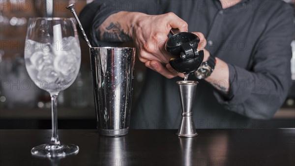 Bartender preparing refreshing cocktail