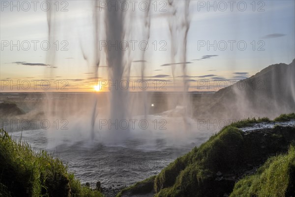 Seljalandsfoss waterfall at sunset