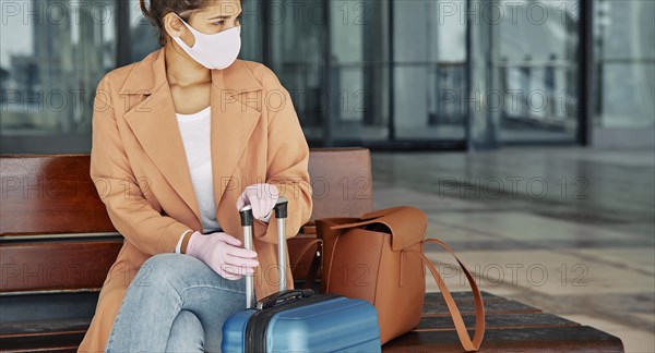 Woman with gloves medical mask airport during pandemic