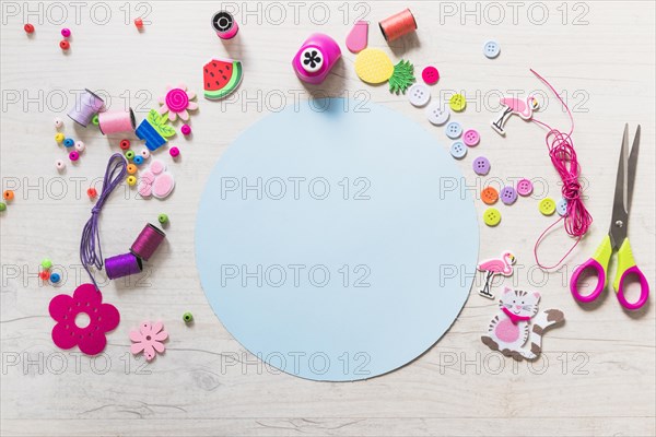 Circular blue blank paper with decorative elements textured backdrop