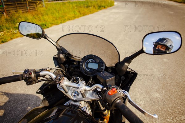 Motorbike grips with rearview mirrors view biker