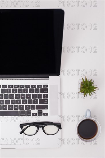 Flat lay desk concept with laptop template