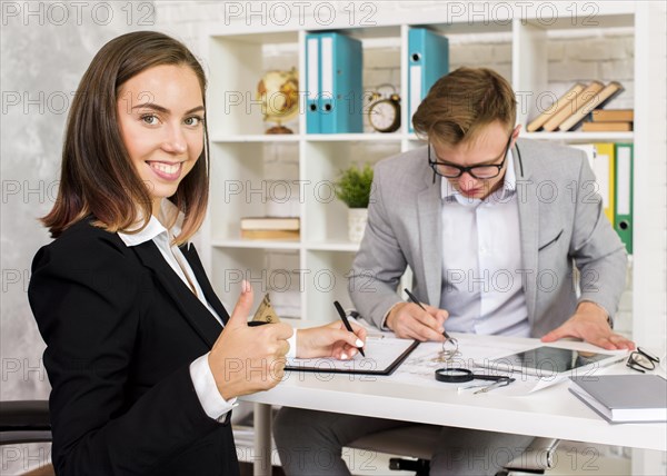 Young woman appreciates work architect