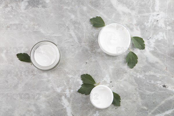 Flat lay body cream products marble background