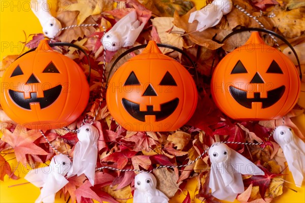 Halloween orange pumpkins on a background of yellow