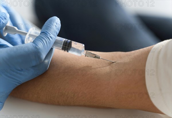 Doctor injecting vaccine woman s arm