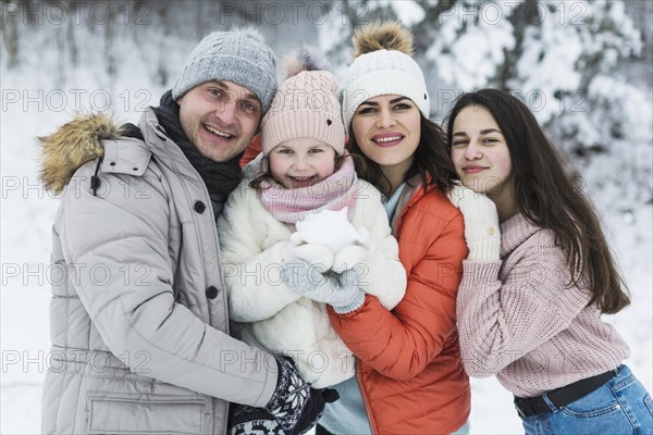 Beautiful family posing camera