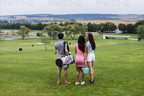 Back view friends golf course