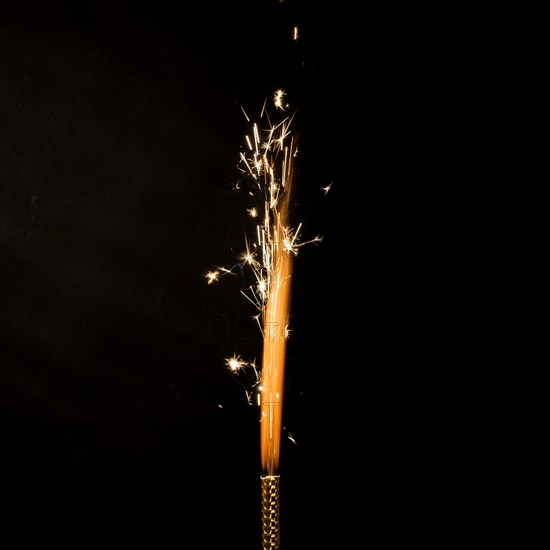 Flame with sparkles black background