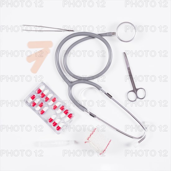 Pill blister pack with stethoscope medical equipments white background