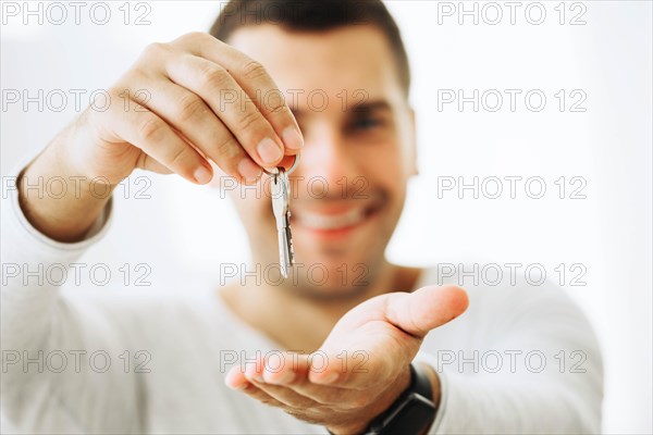 Content man holding new keys