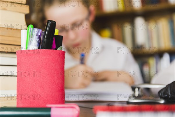 Girl studying desk with stationery