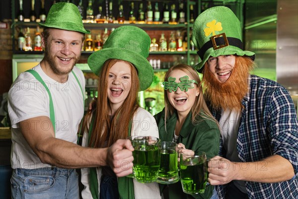 Front view smiley people celebrating st patrick s day