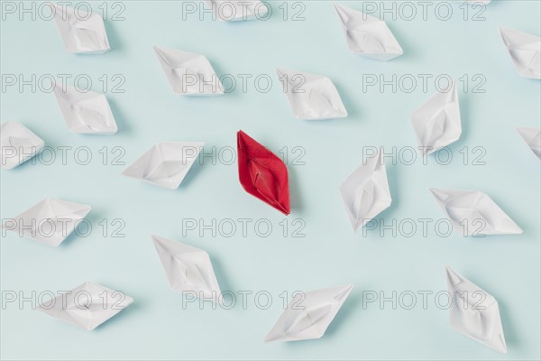 Origami boats representing leadership concept