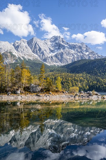 Zugspitze massif and Zugspitze reflected in Eibsee lake